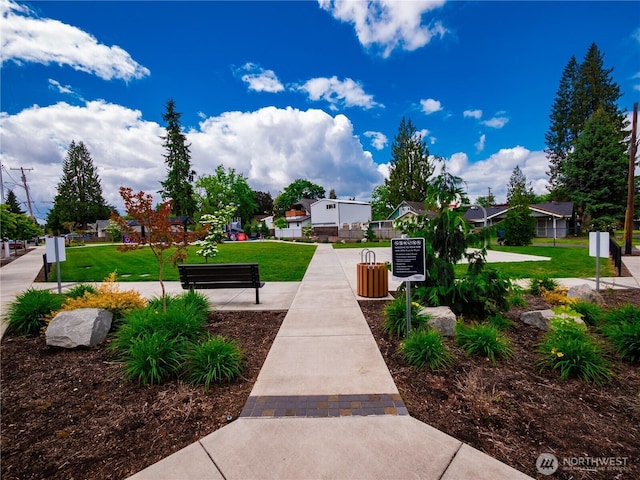 view of home's community with a yard and a residential view