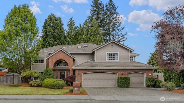 traditional home featuring a tiled roof, driveway, a garage, and brick siding