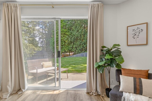 doorway to outside featuring wood finished floors