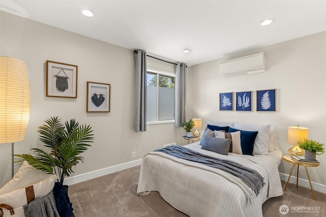 bedroom with a wall unit AC, carpet flooring, baseboards, and recessed lighting