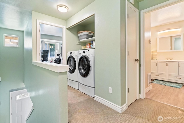 1342 NE Jasmine Ln, Bremerton, WA 98311 - washroom featuring separate washer and dryer, light colored carpet, and baseboards