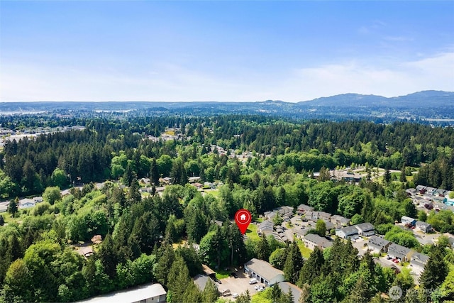 1342 NE Jasmine Ln, Bremerton, WA 98311 - aerial overview of property's location with a forest and a mountainous background