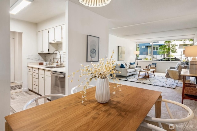 4540 8th Ave NE Unit 104, Seattle, WA 98105 - dining space with baseboards and light wood-type flooring