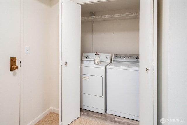 4540 8th Ave NE Unit 104, Seattle, WA 98105 - laundry room with washing machine and dryer and light wood-type flooring