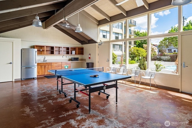 4540 8th Ave NE Unit 104, Seattle, WA 98105 - playroom with finished concrete flooring, a sink, and baseboards