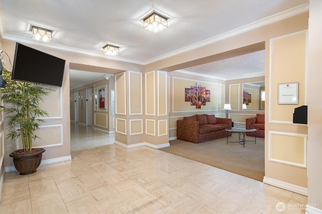 4540 8th Ave NE Unit 104, Seattle, WA 98105 - community lobby with crown molding, a textured ceiling, and a decorative wall