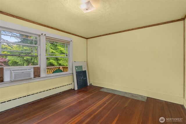 4319 SW Mills St, Seattle, WA 98136 - spare room featuring a baseboard radiator, dark wood-type flooring, baseboards, cooling unit, and ornamental molding