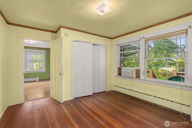 4319 SW Mills St, Seattle, WA 98136 - unfurnished bedroom with a baseboard radiator, dark wood-type flooring, cooling unit, a closet, and ornamental molding