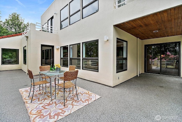 11950 NE 36th Pl, Bellevue, WA 98005 - view of patio / terrace featuring a balcony and outdoor dining area