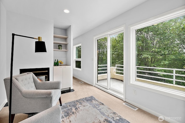 11950 NE 36th Pl, Bellevue, WA 98005 - living area featuring baseboards, recessed lighting, and a glass covered fireplace