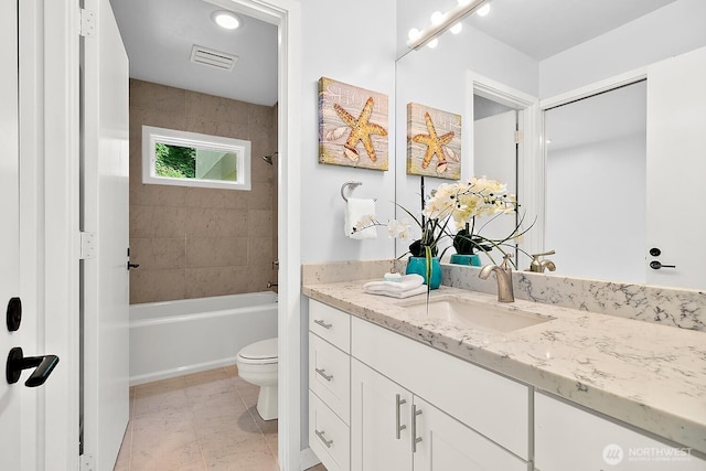 11950 NE 36th Pl, Bellevue, WA 98005 - bathroom featuring vanity, toilet, and shower / bathtub combination