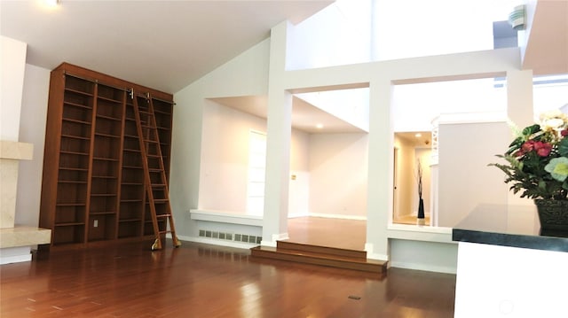 11950 NE 36th Pl, Bellevue, WA 98005 - unfurnished living room with wood finished floors, high vaulted ceiling, and baseboards