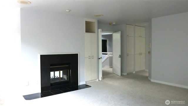 11950 NE 36th Pl, Bellevue, WA 98005 - unfurnished bedroom with a multi sided fireplace, carpet flooring, and baseboards