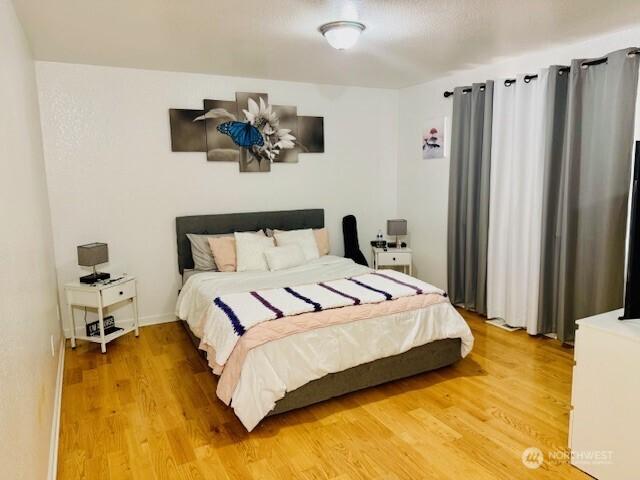 bedroom featuring light wood-style flooring