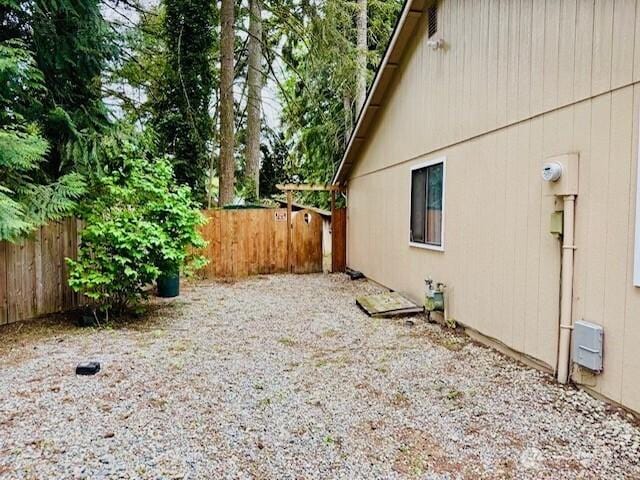 view of home's exterior featuring fence
