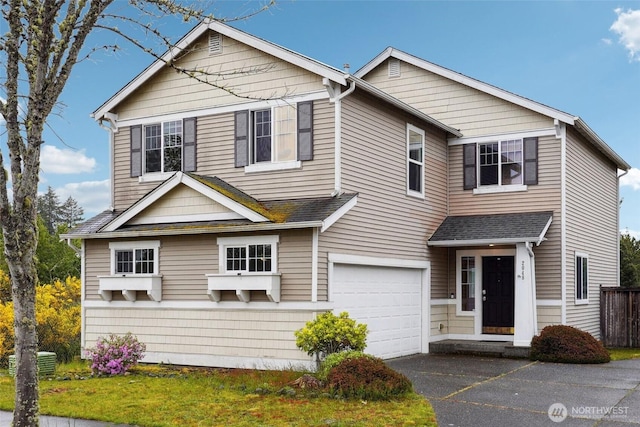 2048 Jensen Ave, Dupont, WA 98327 - traditional home featuring a garage, driveway, and fence