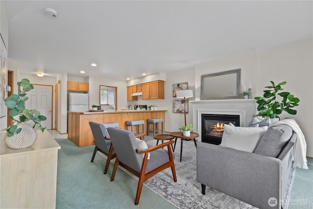 236 W Maberry Dr Unit 102, Lynden, WA 98264 - living area with a glass covered fireplace, light carpet, and recessed lighting