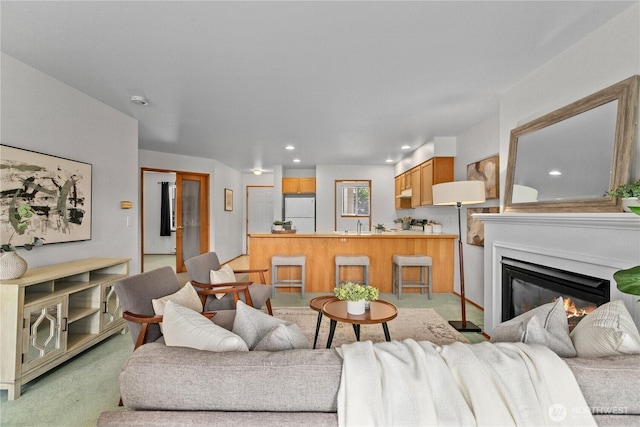 236 W Maberry Dr Unit 102, Lynden, WA 98264 - living room with light carpet, a glass covered fireplace, and recessed lighting