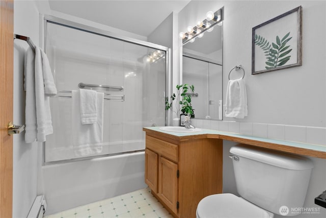 236 W Maberry Dr Unit 102, Lynden, WA 98264 - full bathroom with toilet, vanity, a baseboard radiator, combined bath / shower with glass door, and tile patterned floors