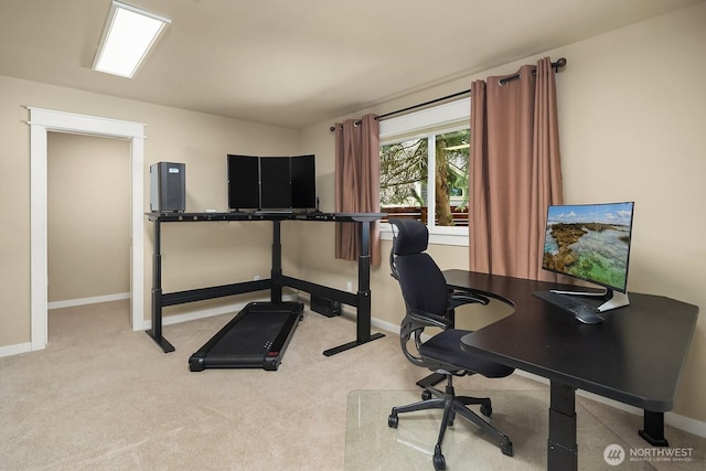 carpeted office space featuring baseboards