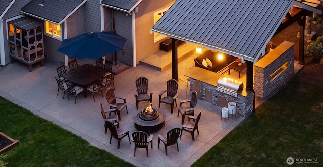 view of patio / terrace with an outdoor fire pit, grilling area, and area for grilling