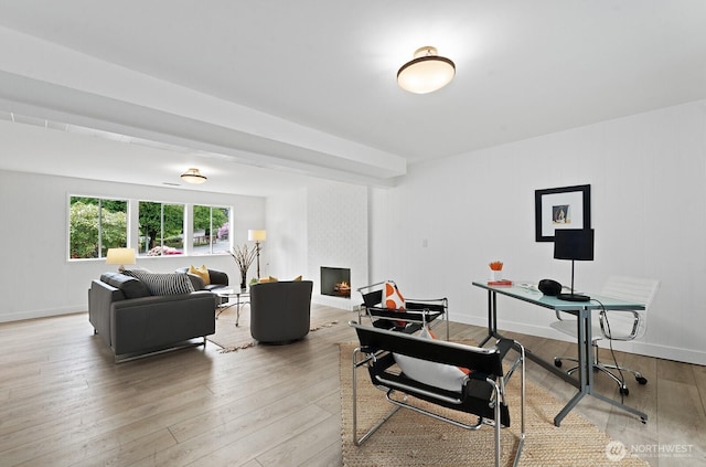 office space with light wood-style flooring and baseboards