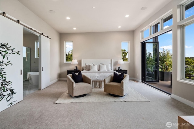 bedroom featuring carpet, a barn door, recessed lighting, access to outside, and connected bathroom