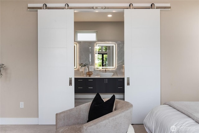 bathroom featuring baseboards and vanity