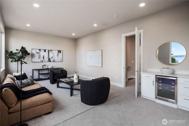 living room featuring beverage cooler, light carpet, recessed lighting, and baseboards