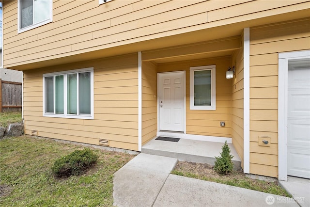 doorway to property featuring crawl space and a garage