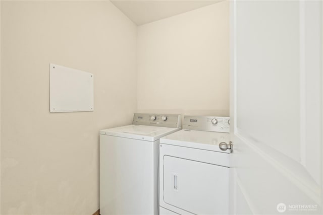 laundry room featuring washer and clothes dryer