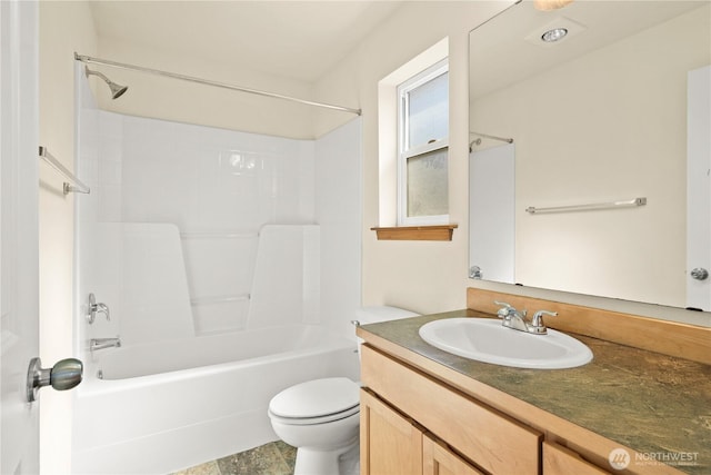 full bath featuring toilet, vanity, and bathing tub / shower combination