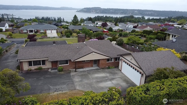 1260 S Karl Johan Ave, Tacoma, WA 98465 - aerial perspective of suburban area featuring a large body of water