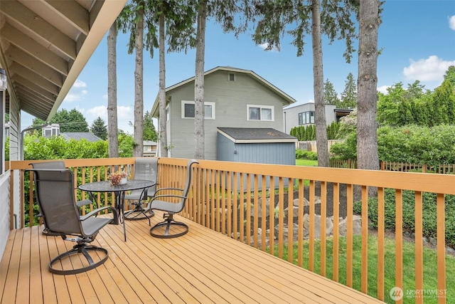 wooden deck featuring outdoor dining space