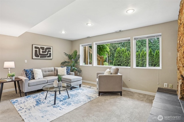 carpeted living room featuring baseboards and recessed lighting