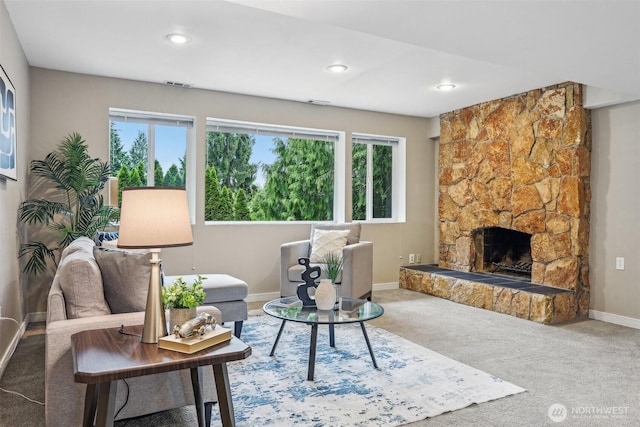 living area with baseboards, a fireplace, carpet, and recessed lighting