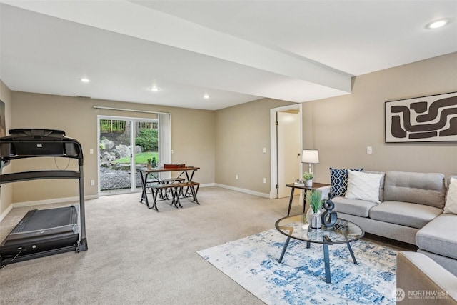 carpeted living area featuring baseboards and recessed lighting