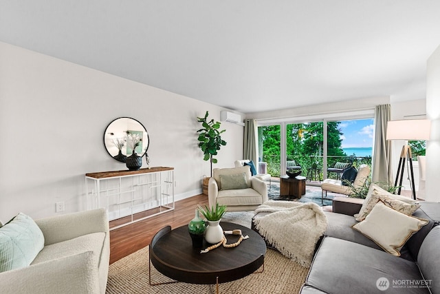 11515 Greenwood Ave N Unit B, Seattle, WA 98133 - living area with wood finished floors and a wall mounted air conditioner