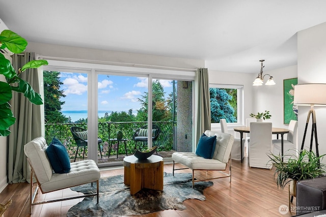 11515 Greenwood Ave N Unit B, Seattle, WA 98133 - living room with a chandelier and wood finished floors