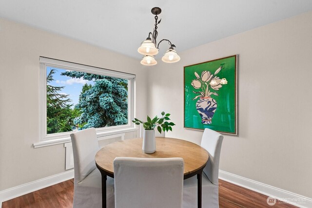 11515 Greenwood Ave N Unit B, Seattle, WA 98133 - dining space with a chandelier and dark wood-type flooring
