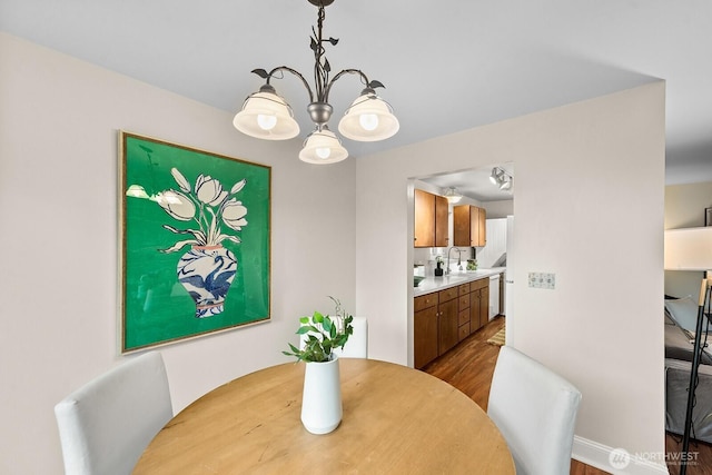 11515 Greenwood Ave N Unit B, Seattle, WA 98133 - dining area featuring a chandelier and dark wood-type flooring