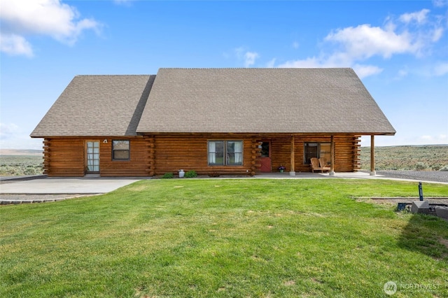 545 Sagebrush Dr, Ephrata, WA 98823 - rear view of house with log exterior, a yard, and roof with shingles