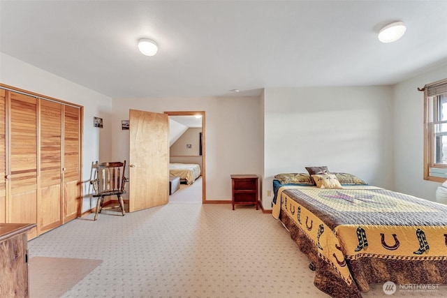 545 Sagebrush Dr, Ephrata, WA 98823 - bedroom with light colored carpet, baseboards, and a closet