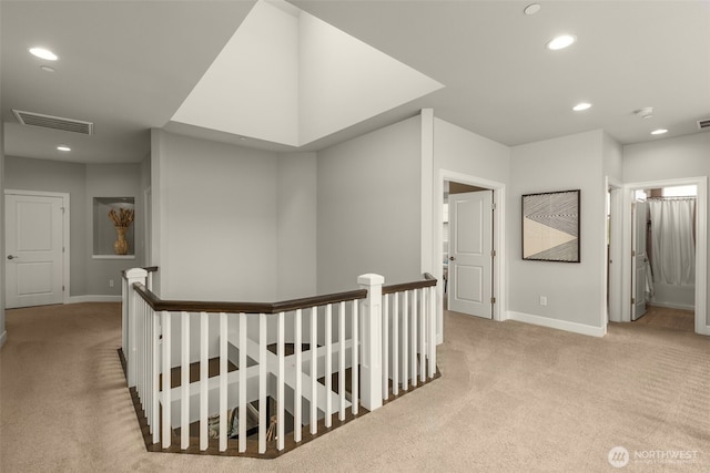 hallway featuring an upstairs landing, carpet, recessed lighting, and baseboards