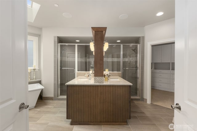 bathroom with a stall shower, vanity, recessed lighting, tile patterned flooring, and baseboards