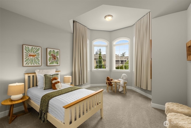 bedroom with carpet and baseboards