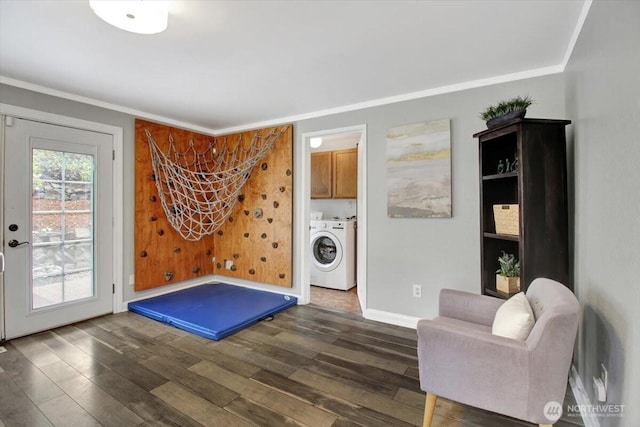 2711 NE 4th Ct, Renton, WA 98056 - living area with separate washer and dryer, dark wood-style floors, crown molding, and baseboards
