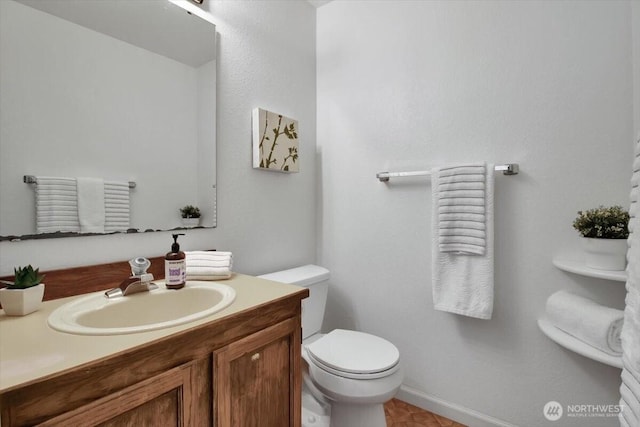 2711 NE 4th Ct, Renton, WA 98056 - bathroom with toilet, vanity, and baseboards