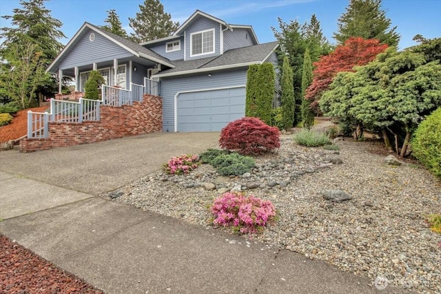 2711 NE 4th Ct, Renton, WA 98056 - view of front of property featuring a porch, driveway, and a garage