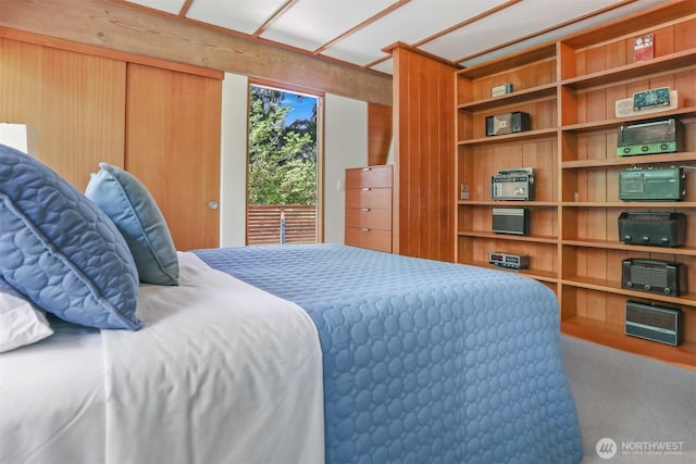 bedroom with carpet floors and access to outside